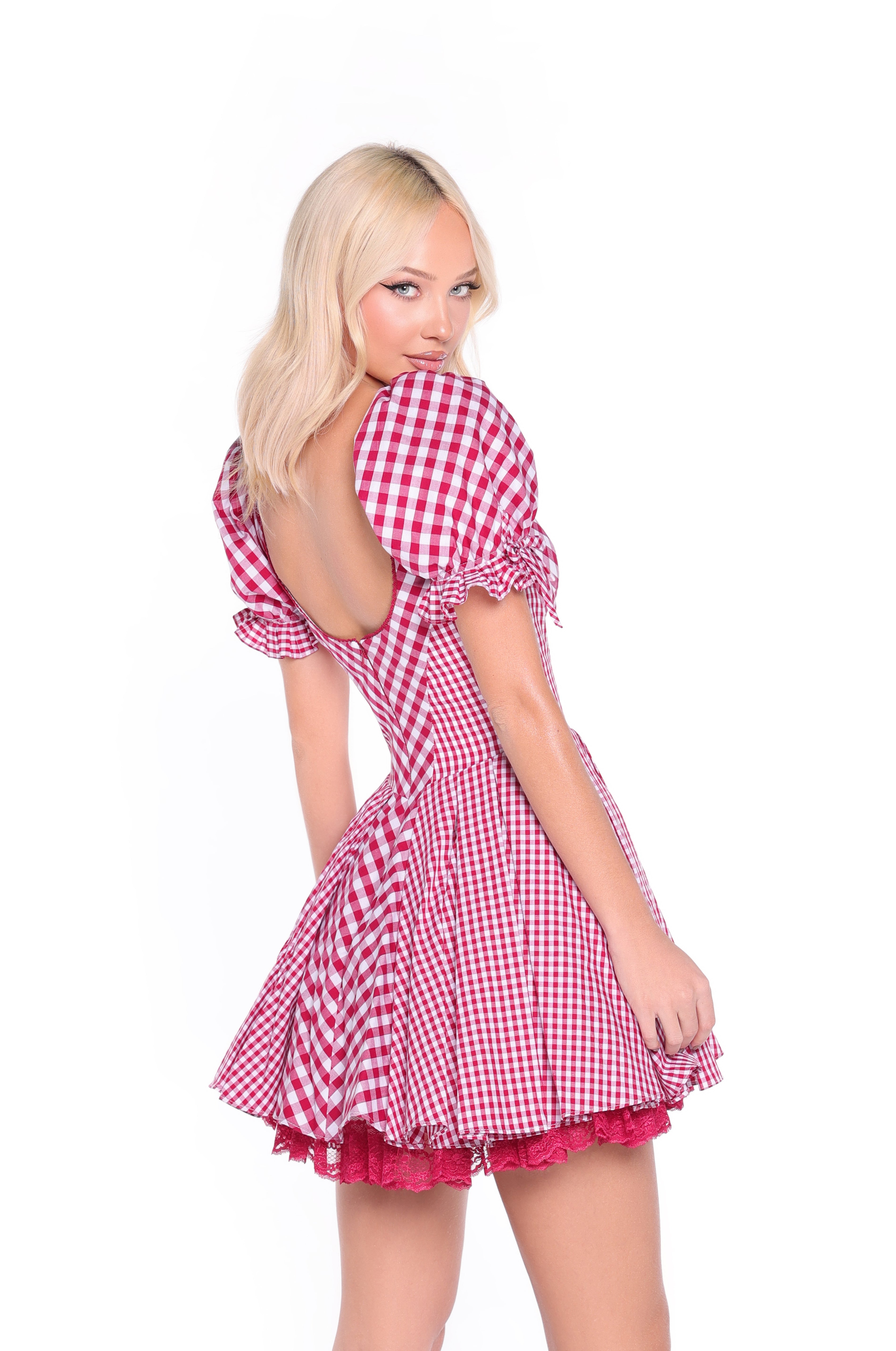 A woman with blonde hair models the Roslyn Cherry Gingham Short Casual Dress—featuring red and white checks, puffed sleeves, and an open back—against a white background.